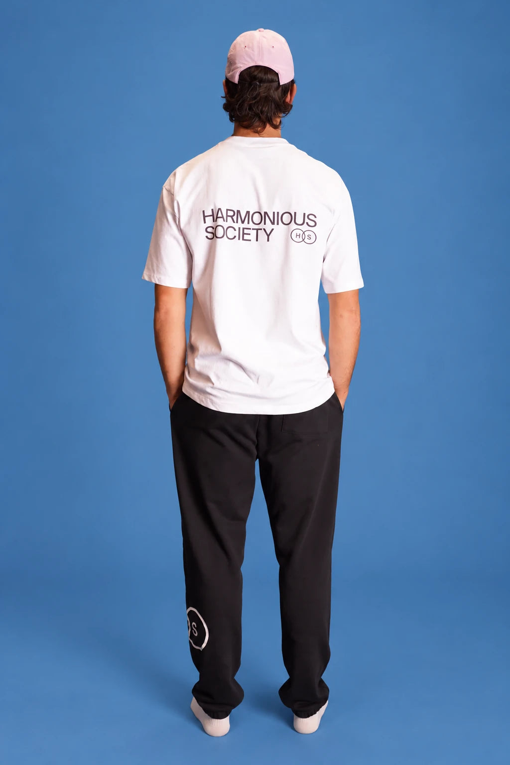 studio back view of the men’s white Own Lane T-shirt
